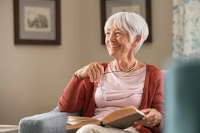 Life Assure Senior Relaxing Reading Book On Couch Blog